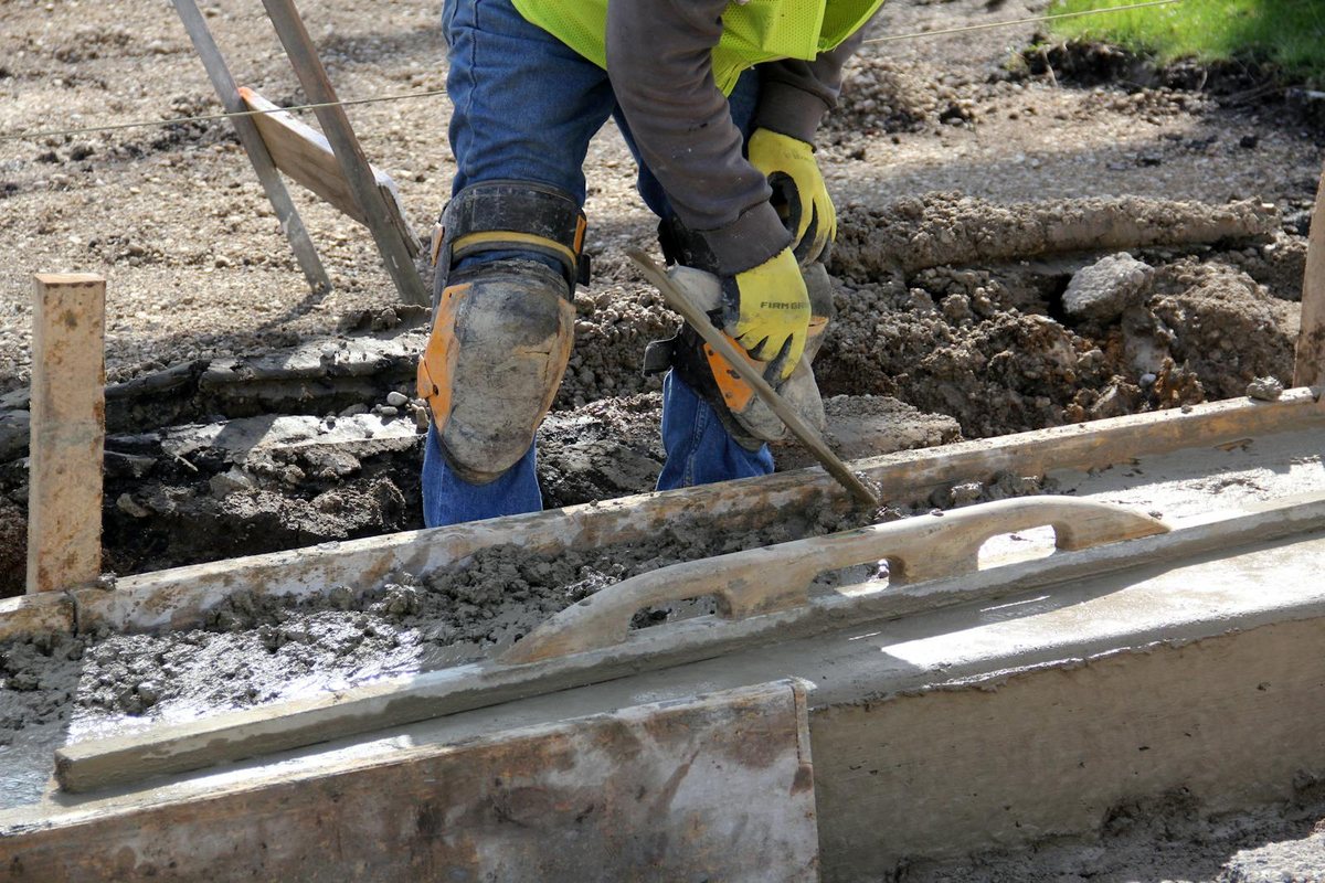 Concrete patio being hand finished with a trowel