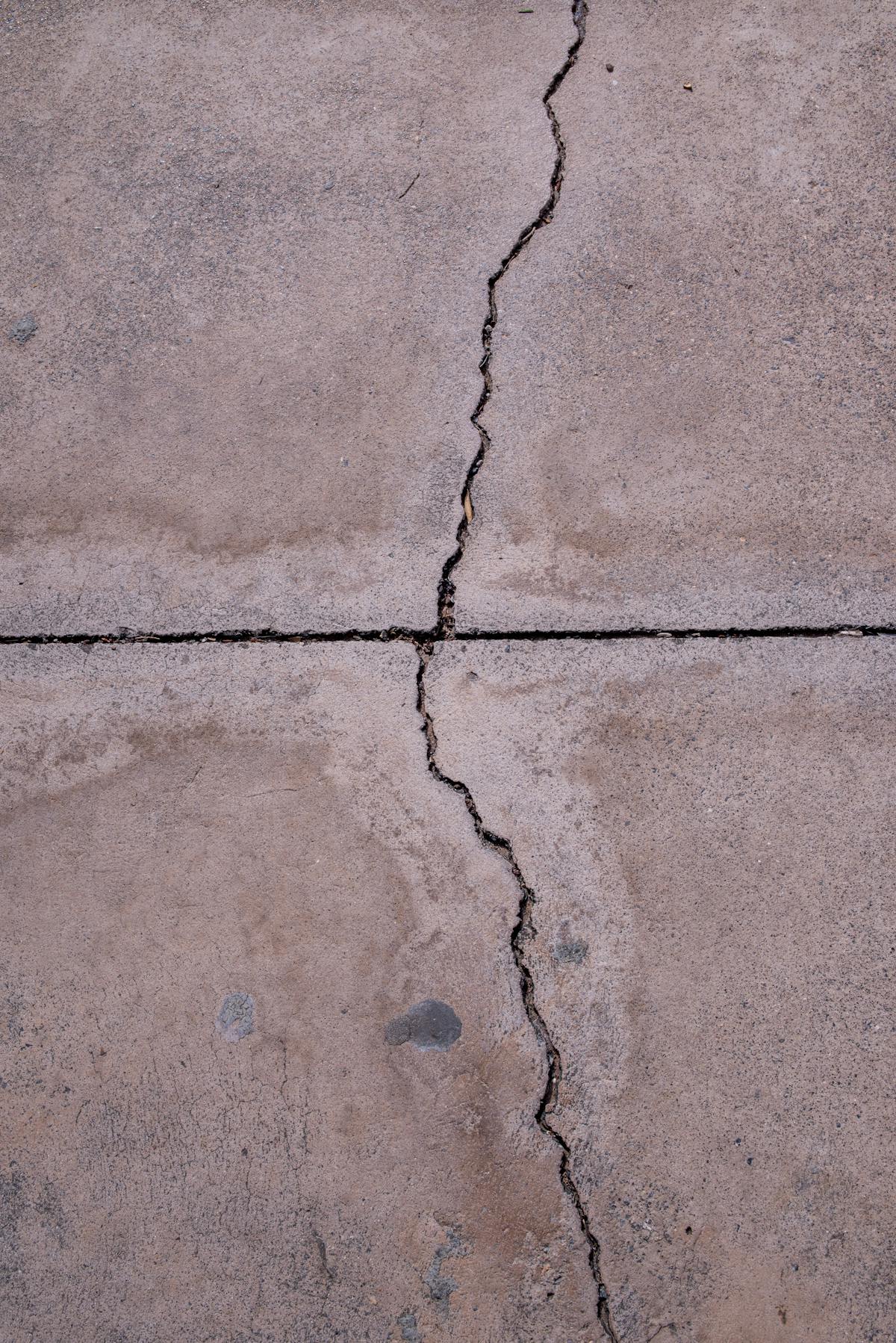 Cracked concrete surface ready for repair or replacement